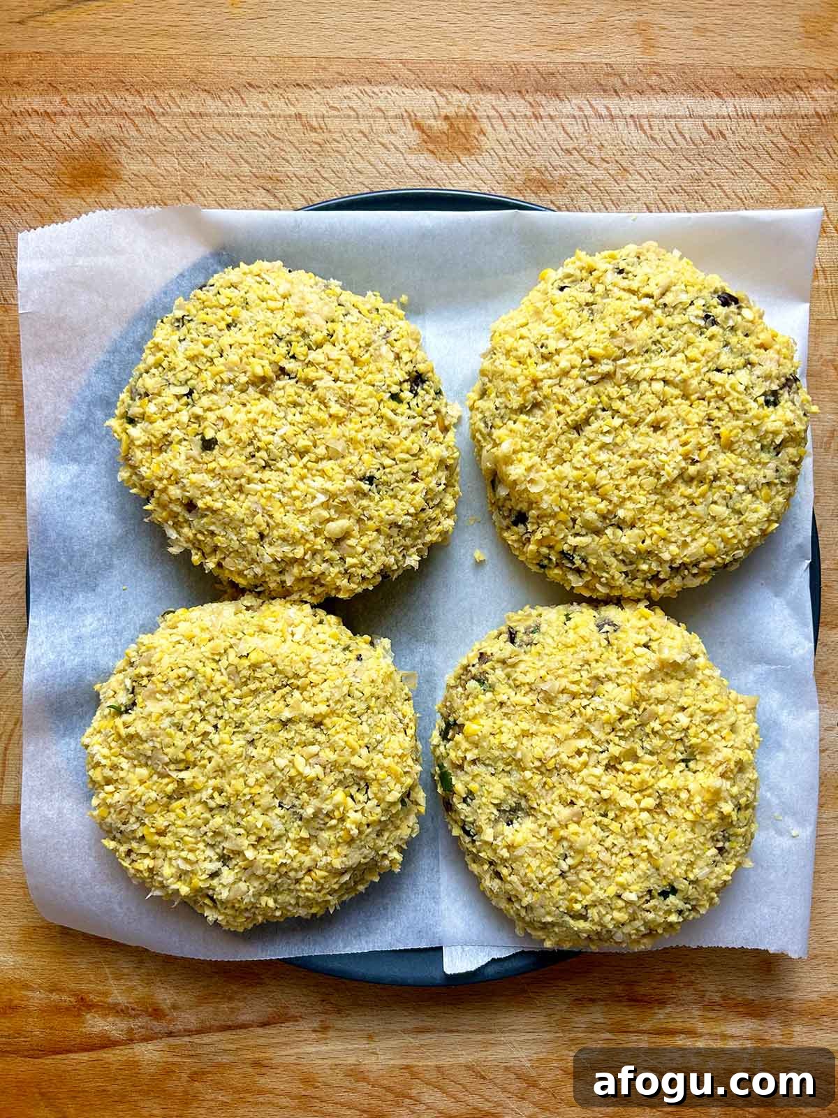 four chickpea crusted patties on plate