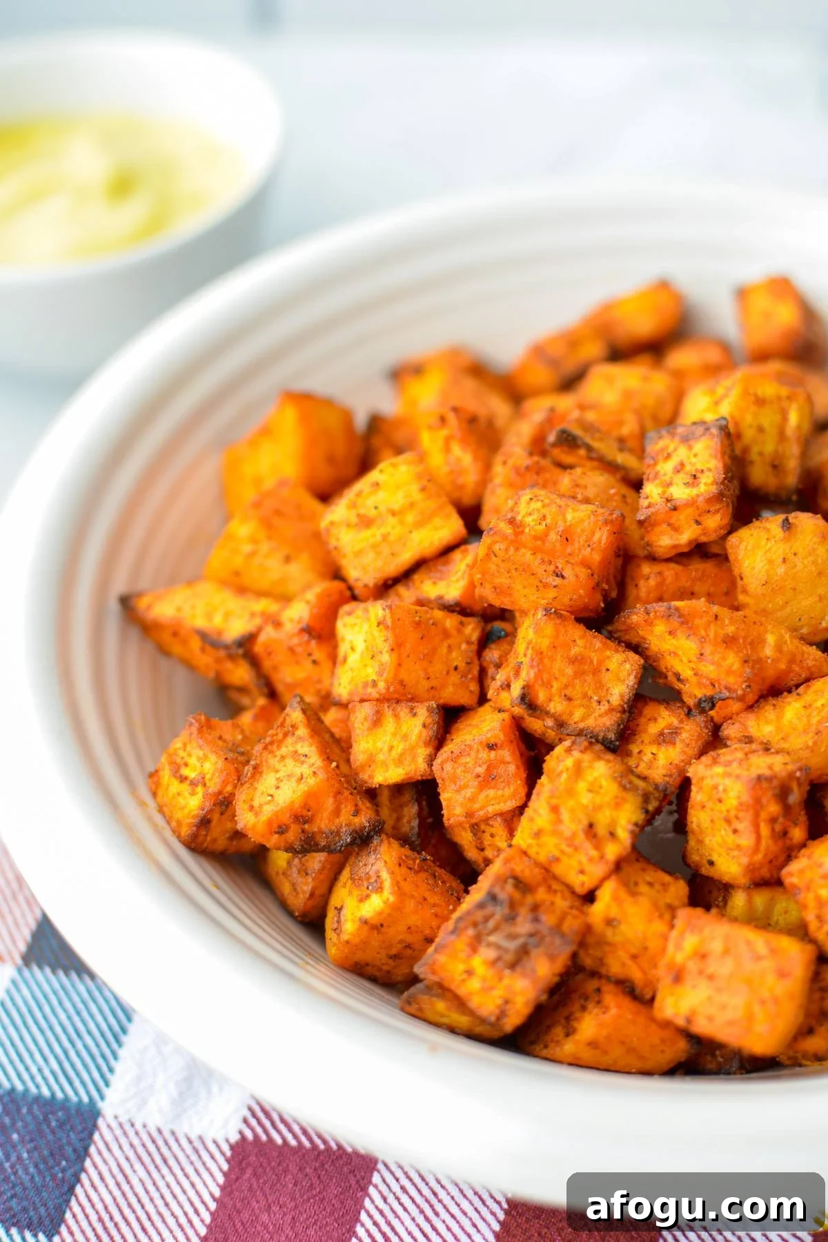 Crispy Air Fryer Sweet Potato Cubes Recipe 2 A bowl of air fried sweet potato cubes.