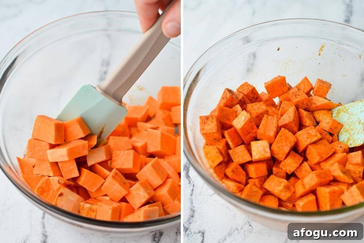 Crispy Air Fryer Sweet Potato Cubes Recipe 6 Tossing sweet potatoes with a seasoned oil.