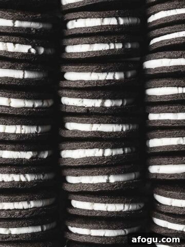 Three rows of vanilla creme filled chocolate sandwich cookies.