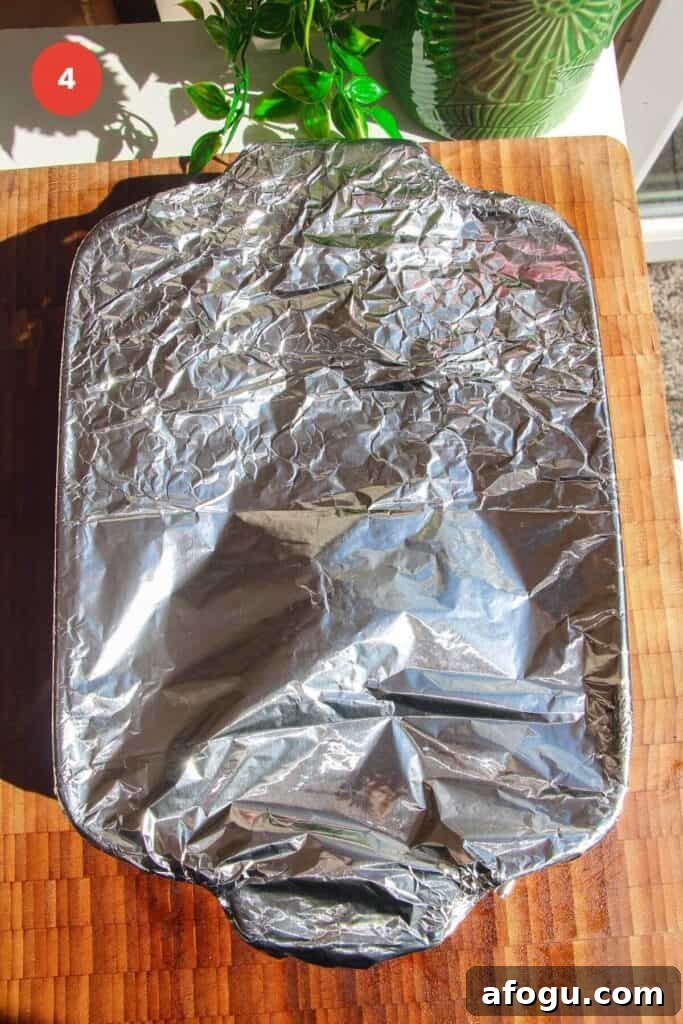 Foil tightly wrapped around an oven dish.