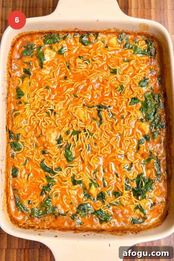 Baked satay ramen in an oven dish.