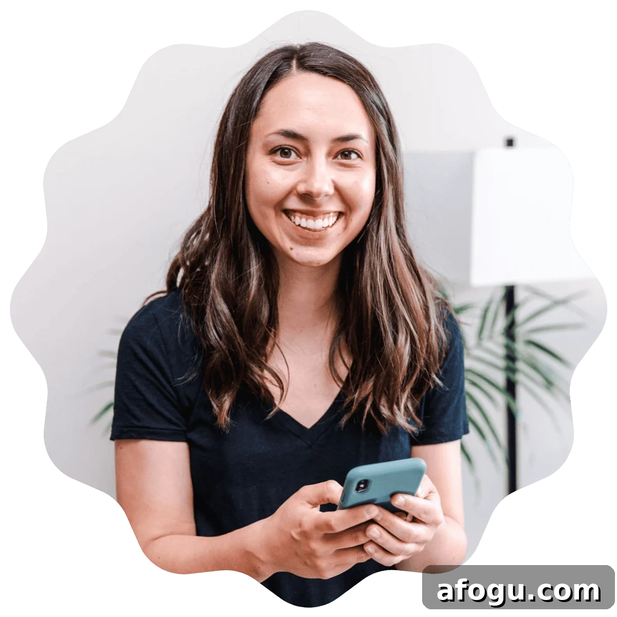 Kayla Burton from Broken Oven Baking Company holding a phone.