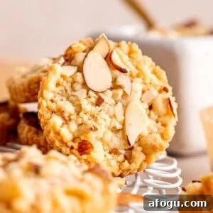 A shortbread cookie with almond filling and sliced almonds on top.