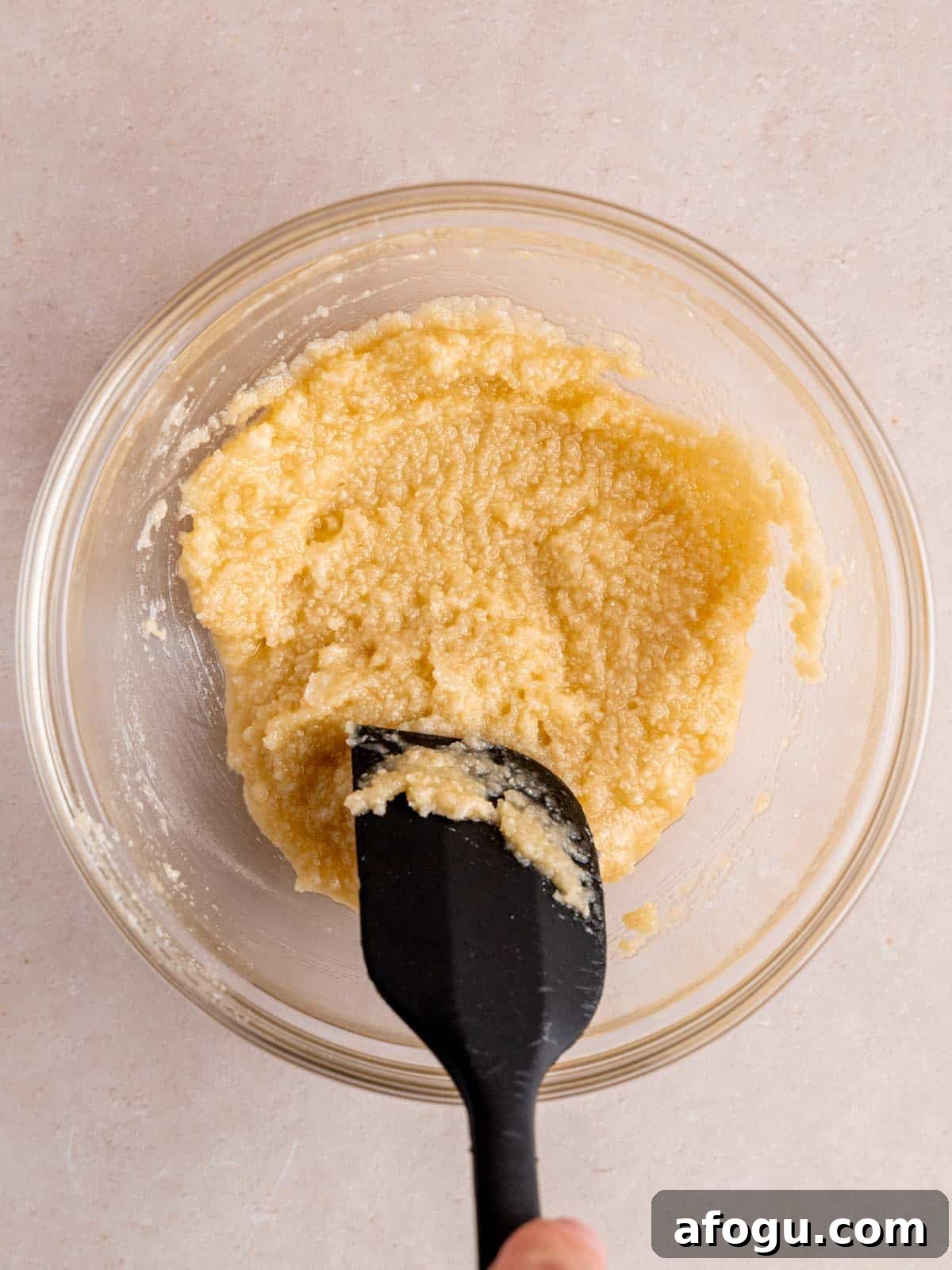 Easy almond filling mixed together in a bowl with a rubber spatula.