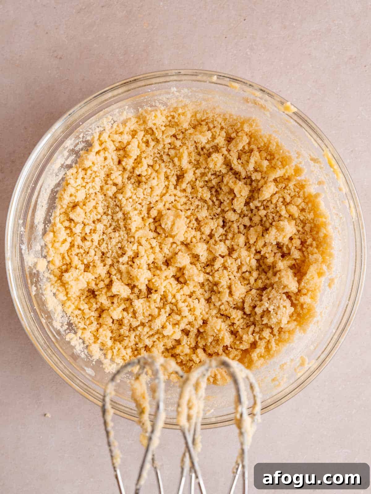 Crumbly shortbread cookie dough in a bowl.