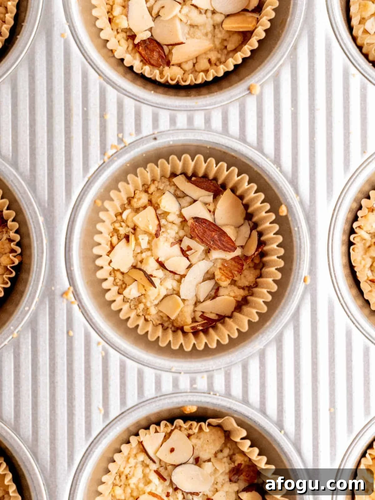 Shortbread cookies with almond filling and a crumbly top with sliced almonds.