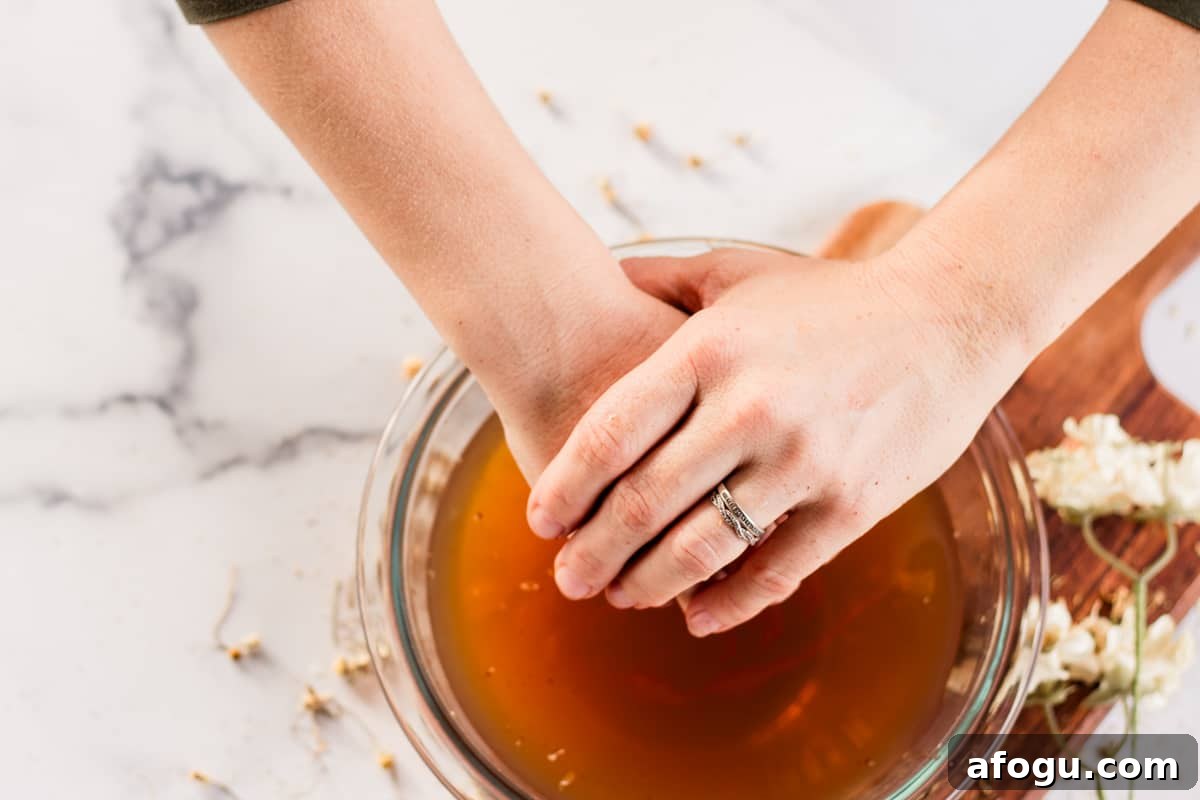 Putting hands into the soak.