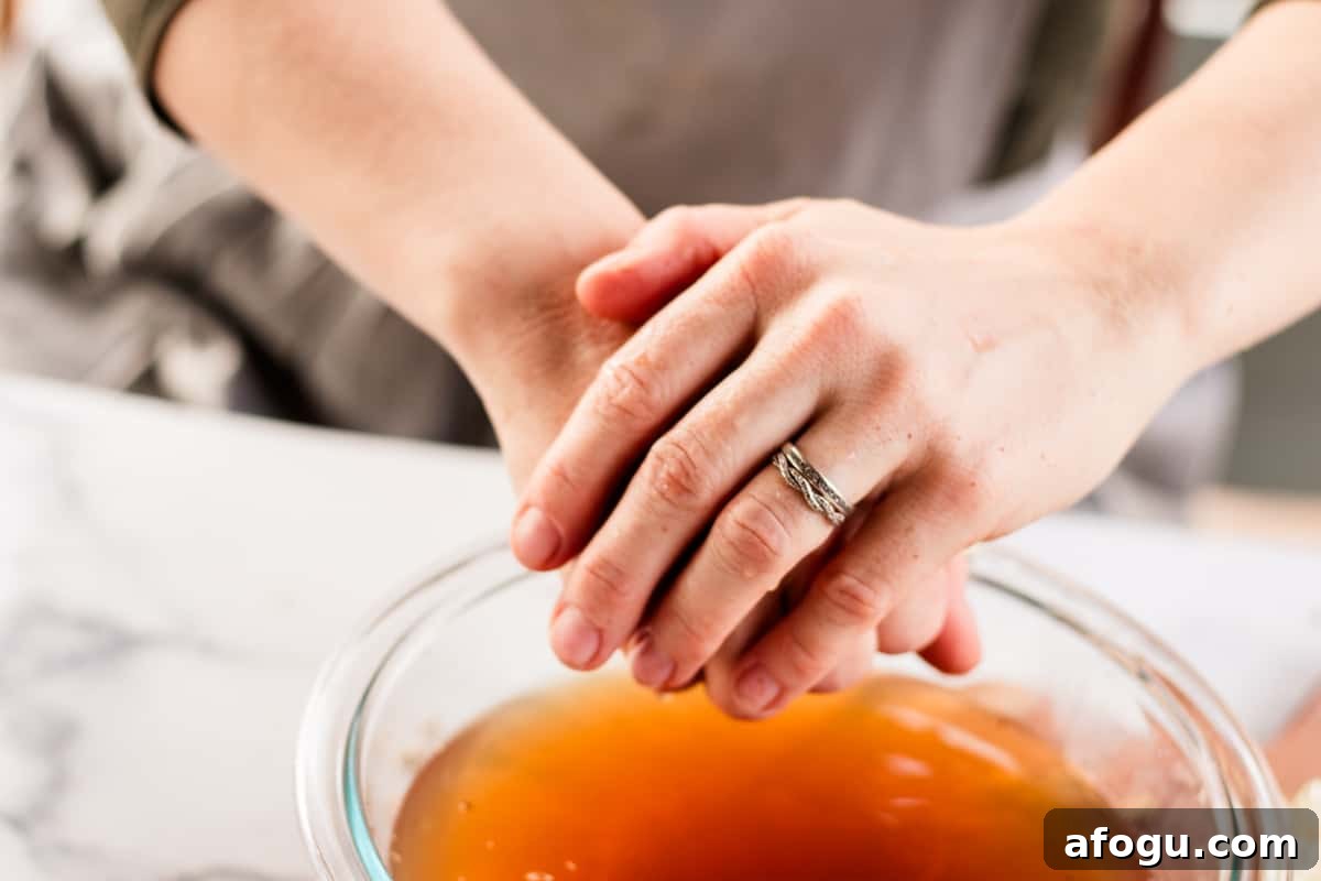 Wiping the hand soak off.