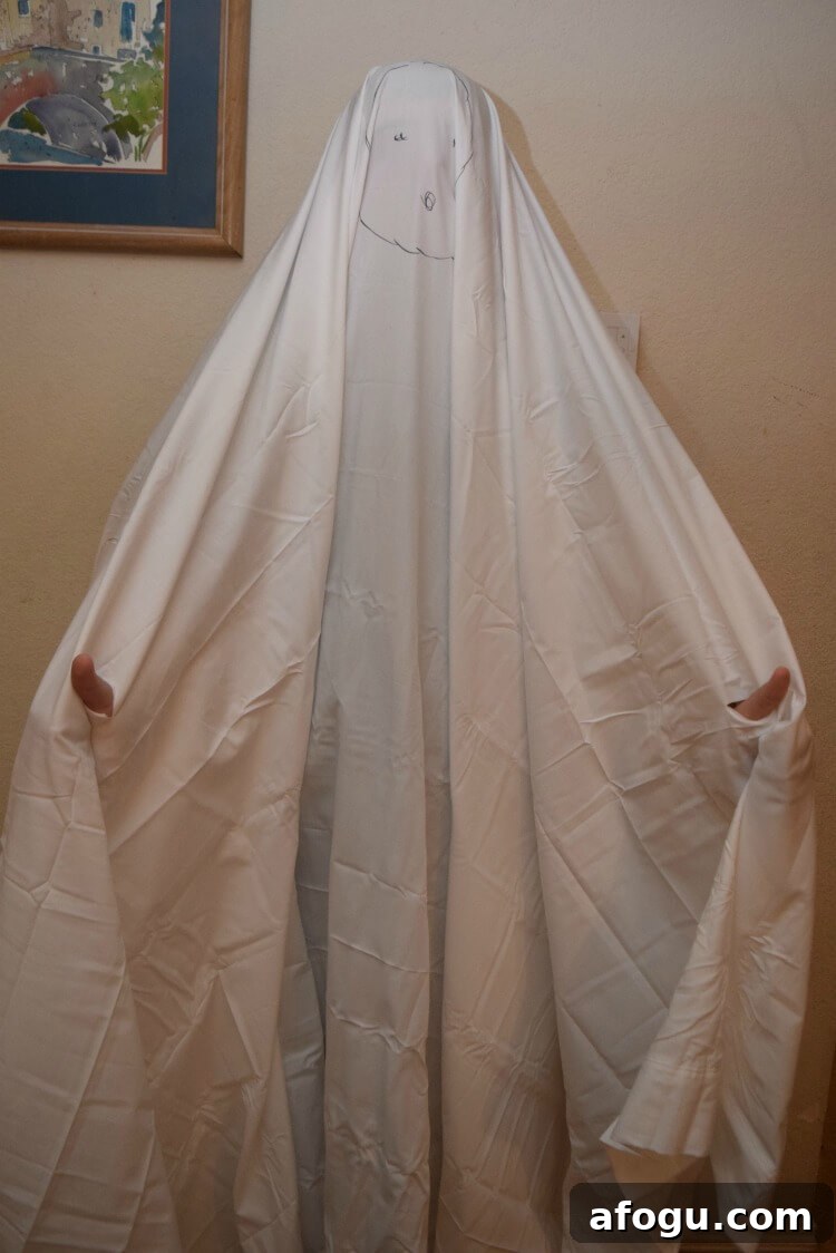 Turning a sheet into a ghost costume