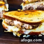 Turkey Reuben Patty Melt with Turkey Burger Patties 5 Turkey Burger Reuben Patty Melts on a cutting board.