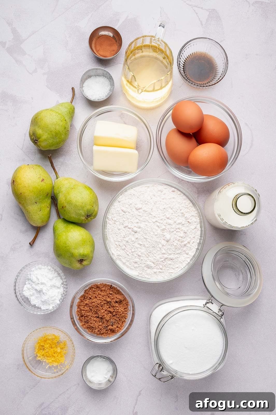 Moist Pear Cake Recipe — 20-Minute Prep, Simple Steps 3 A flat-lay arrangement of fresh Bartlett pears, softened butter, eggs, granulated sugar, and all-purpose flour on a clean kitchen surface, ready for a simple one-bowl pear cake.