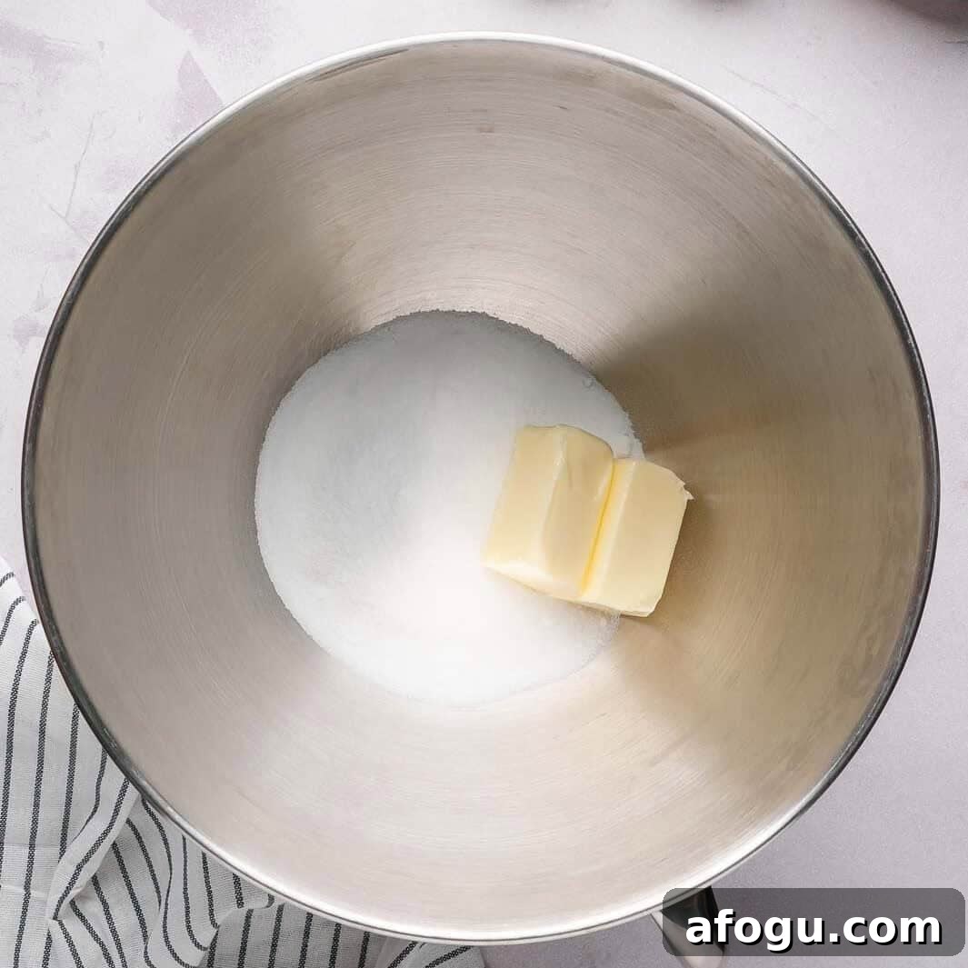 Moist Pear Cake Recipe — 20-Minute Prep, Simple Steps 5 Creaming softened butter and granulated sugar in a stand mixer to create a light and airy sponge cake base.