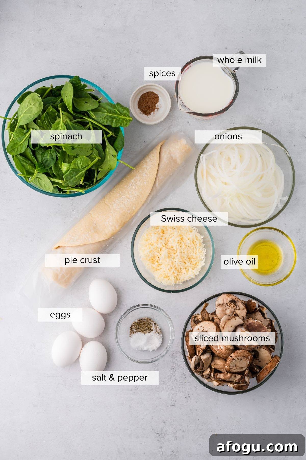 Spinach Mushroom Quiche Recipe — Flaky Crust, Creamy Filling 3 Mushroom spinach quiche ingredients on a kitchen table.