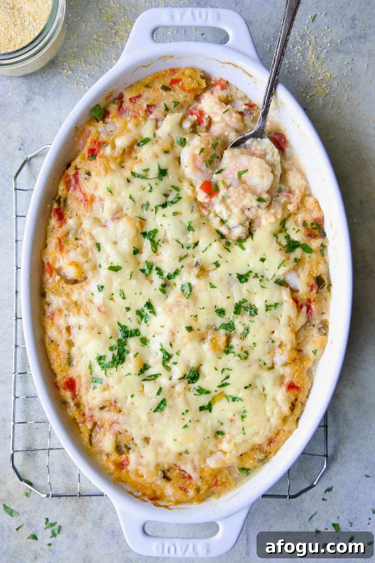 Shrimp and Grits Casserole in white Dutch oven.