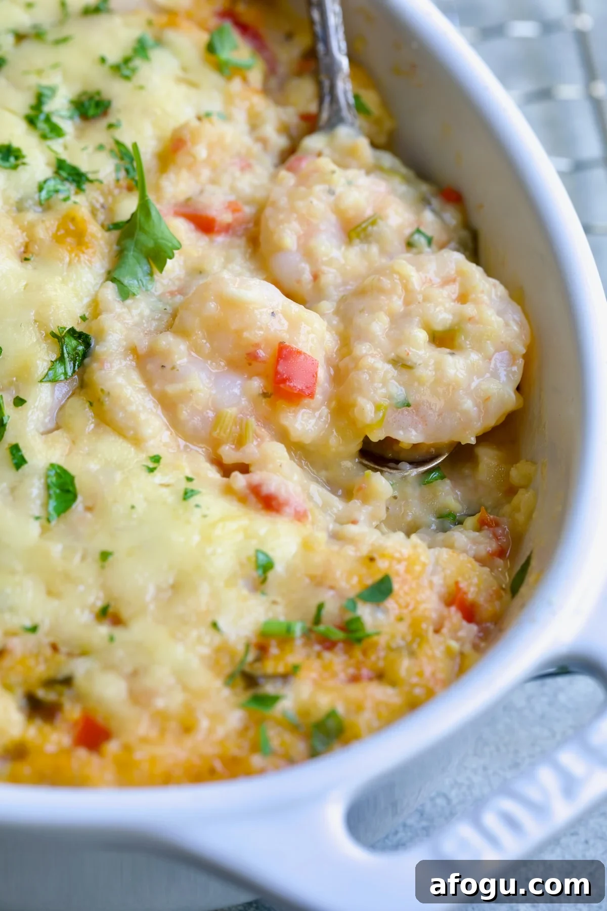 Shrimp and Grits Casserole in white Dutch oven.