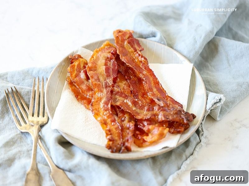 Follow these tips for How to Cook Bacon in the Oven for less mess and a deliciously easy snack or addition to any meal!