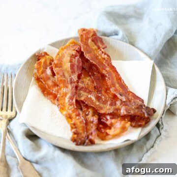 Follow these tips for How to Cook Bacon in the Oven for less mess and a deliciously easy snack or addition to any meal!