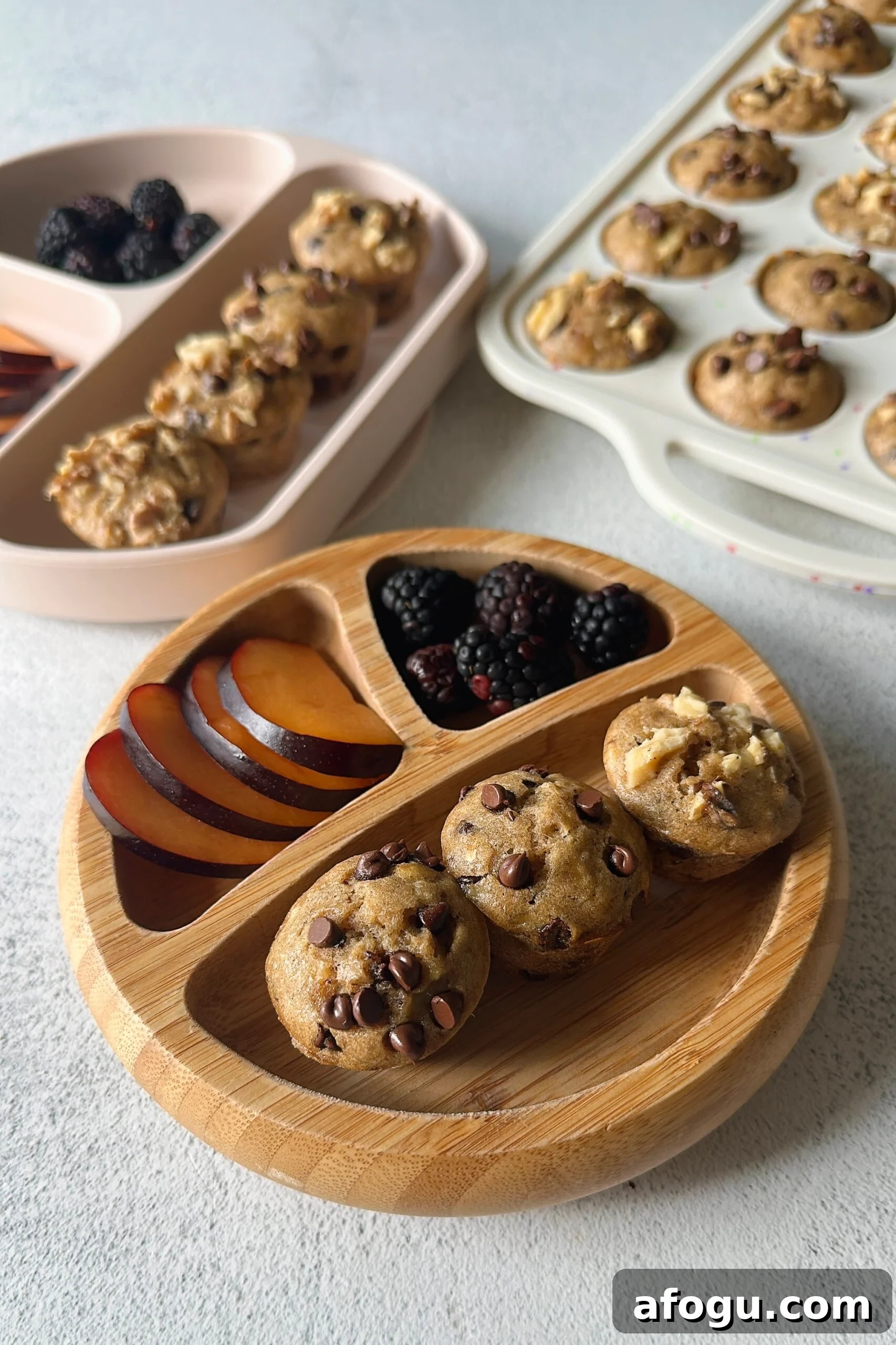 Chocolate chip banana walnut muffins served with fruits.