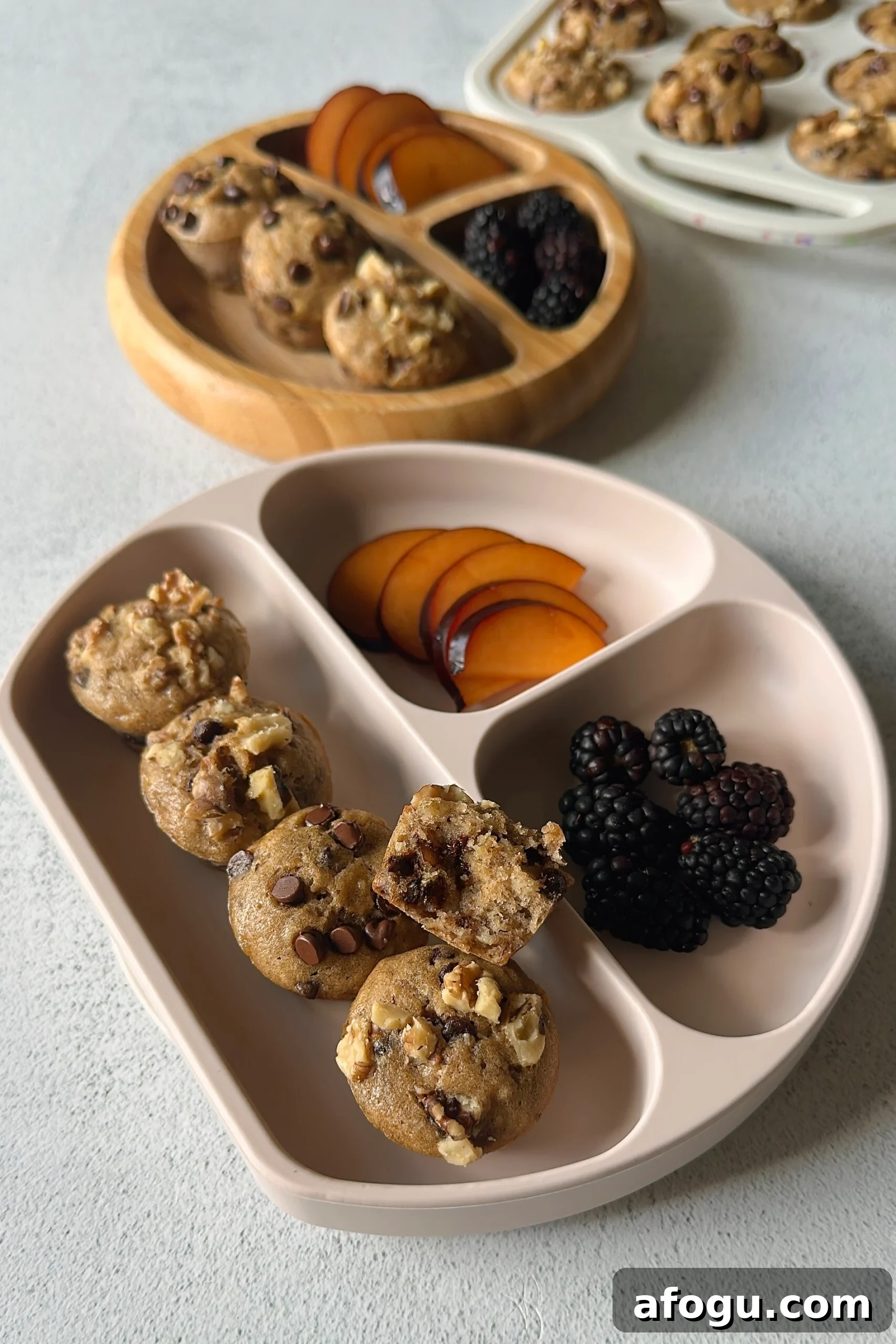 Chocolate chip banana walnut muffins served with fruits.