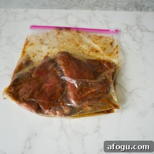 Steak marinating in a ziplock bag