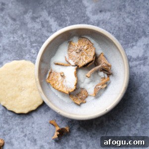 Candy cap mushrooms in a bowl of sugar