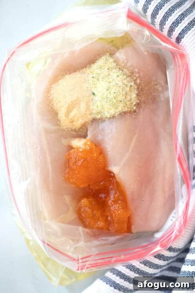 apricot chicken marinade with chicken breasts in a bag.