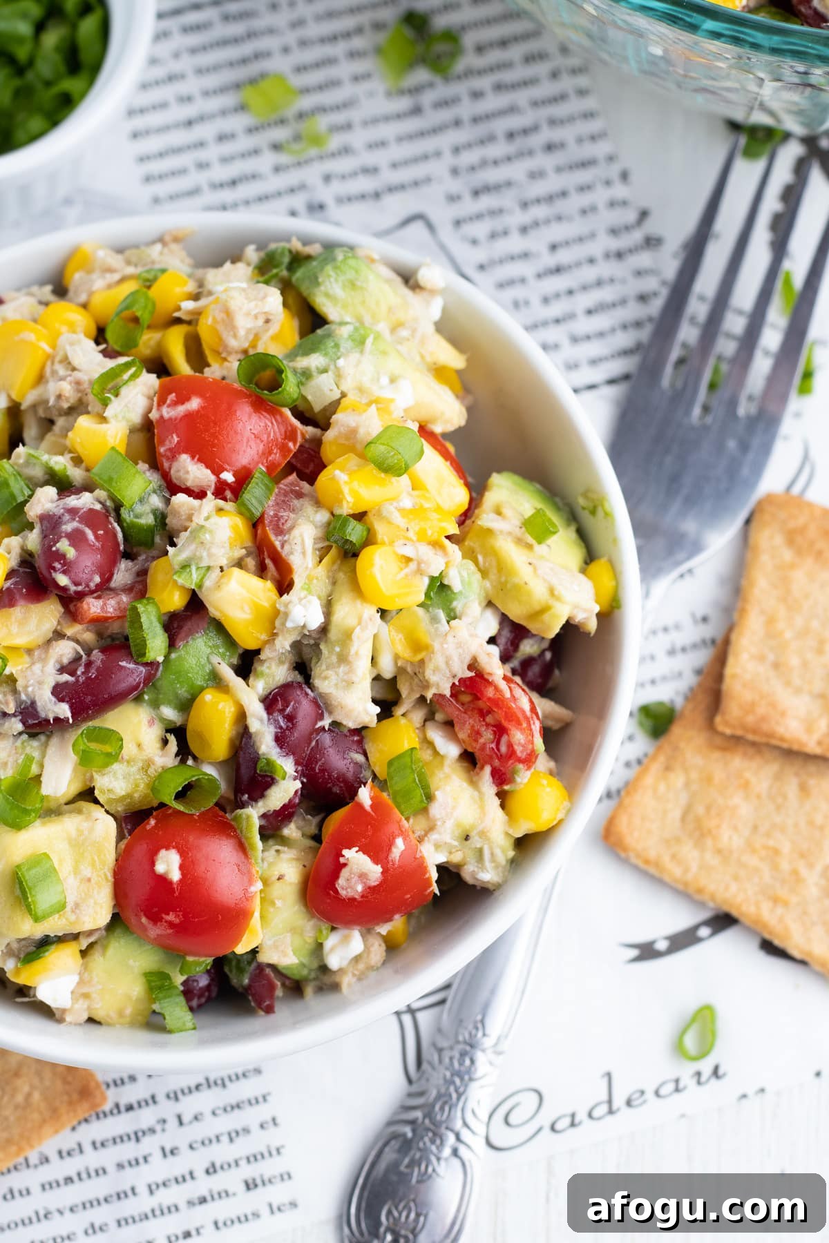 Tuna, Corn, Avocado & White Bean Salad with Zesty Dressing 2 Picture of the tuna and bean salad with corn and avocado, tomatoes and green onions.