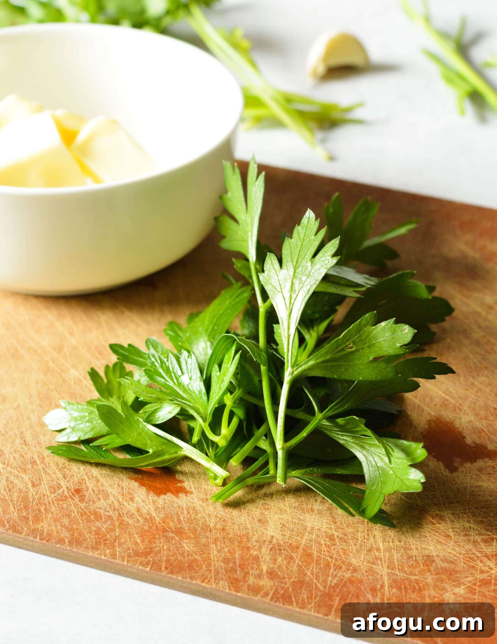 parsley on a cutting board. 