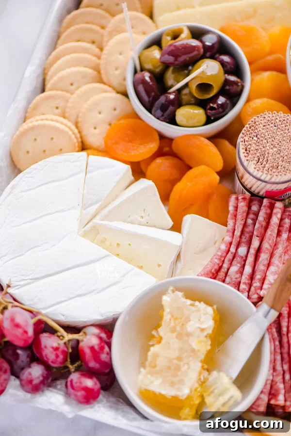 brie cut into wedges on a gluten free charcuterie board