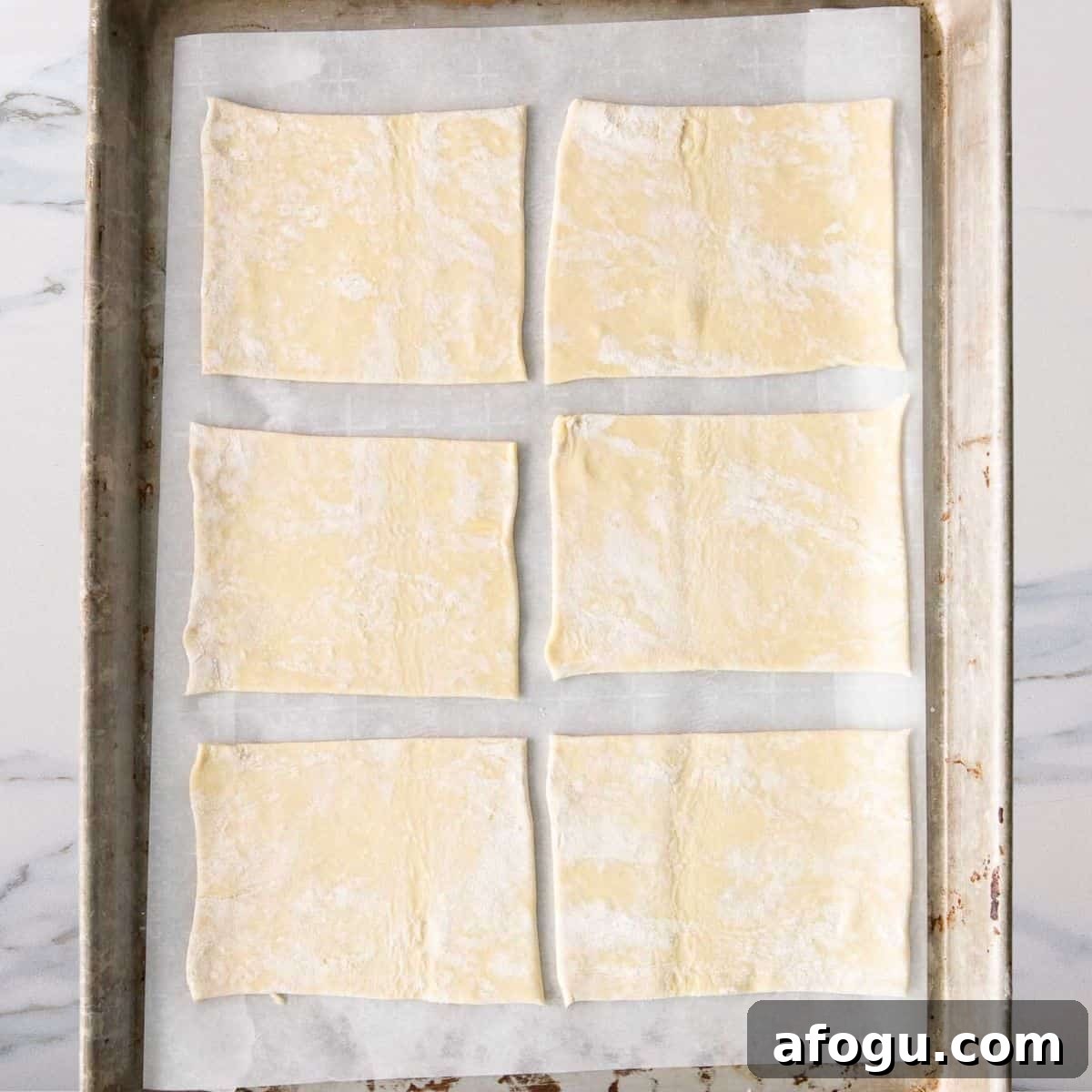 cut puff pastry dough ready for spinach hand pies
