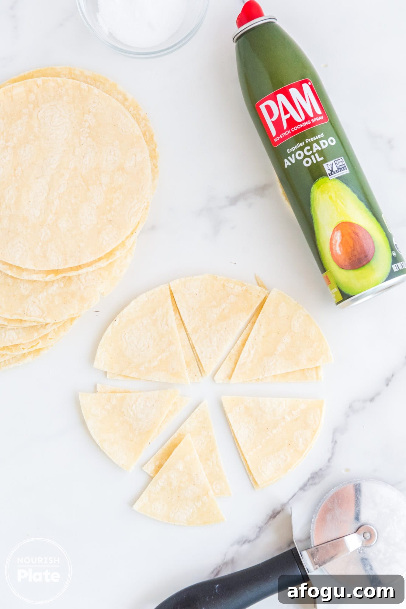 Crispy Air Fryer Tortilla Chips Recipe for Homemade Snacking 4 Slicing taco shells into triangles
