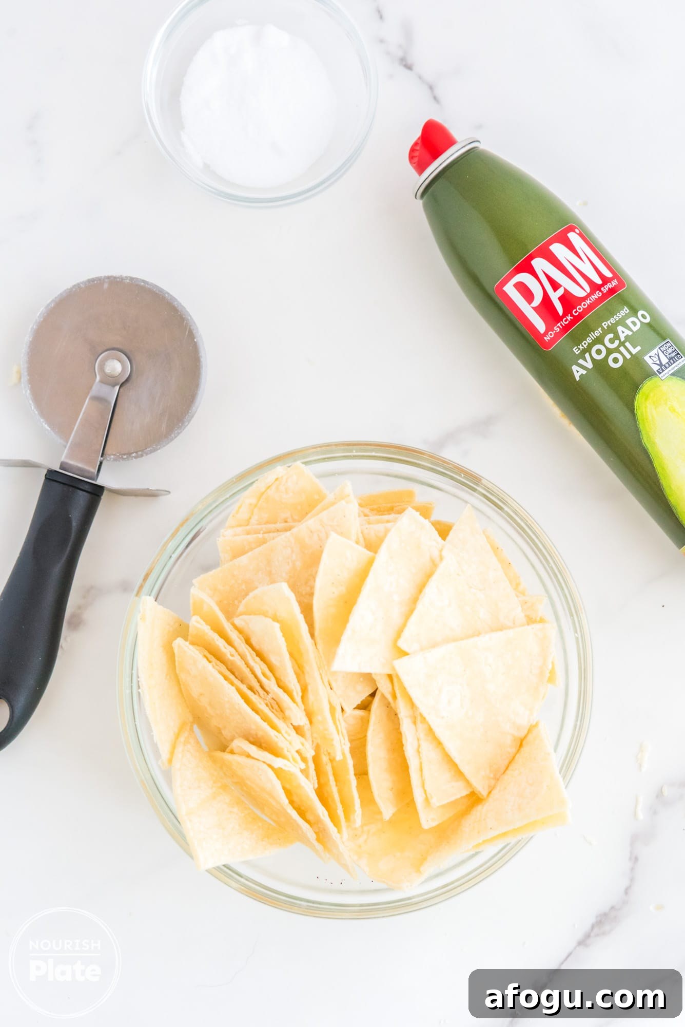 Crispy Air Fryer Tortilla Chips Recipe for Homemade Snacking 5 Tortilla triangles arranged in air fryer basket