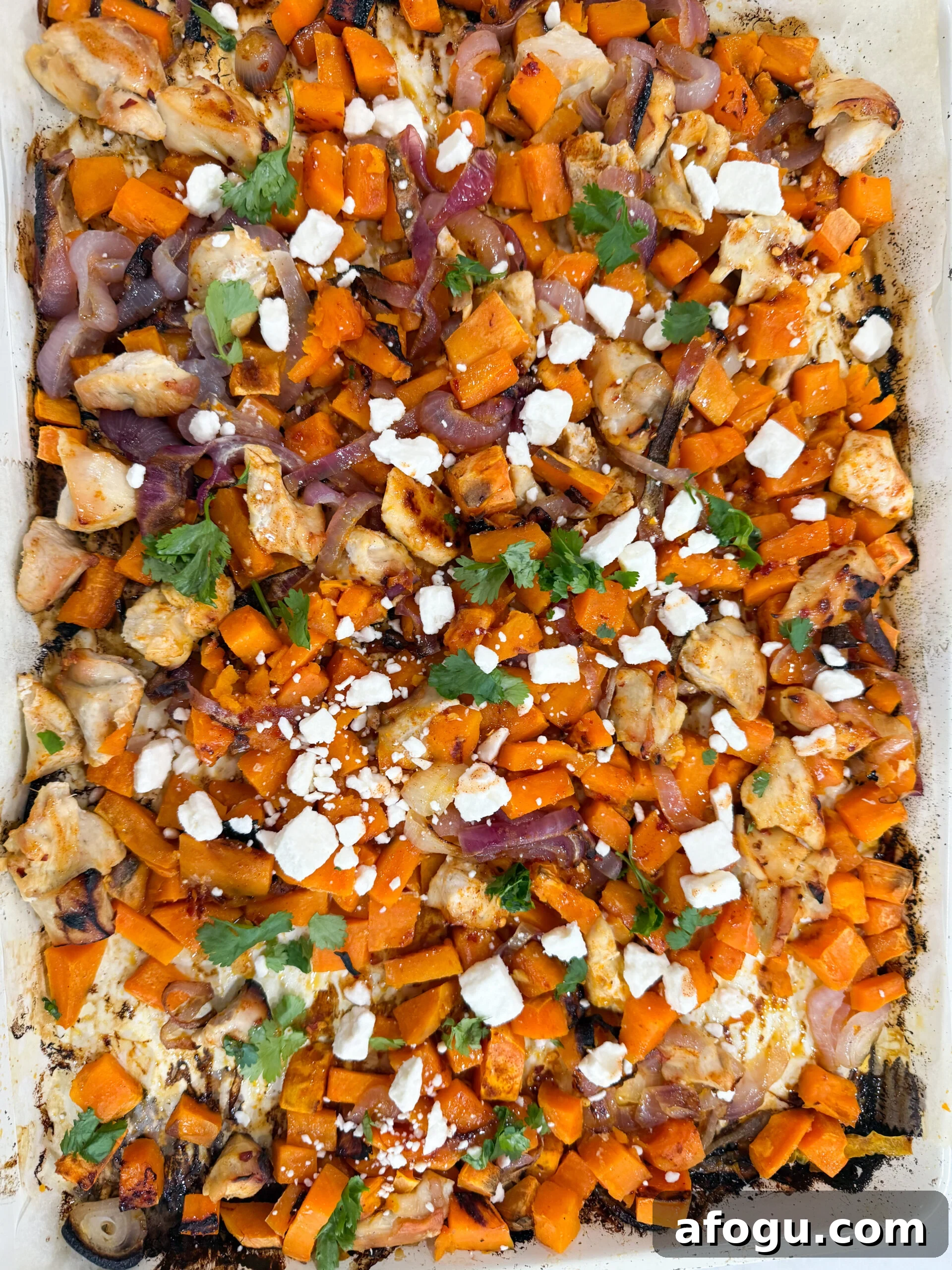 Roasted hot honey chicken with sweet potatoes and red onion