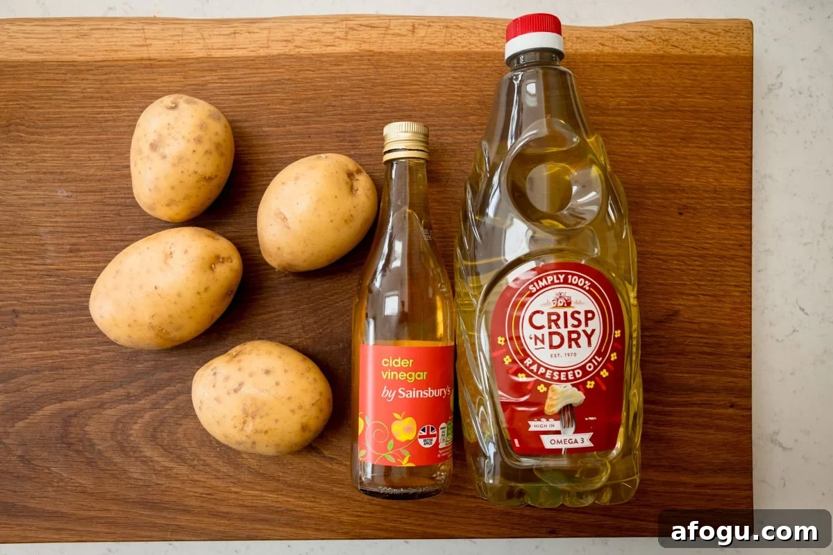 The ingredients of Chip Shop-Style Chips laid out on a cutting board.