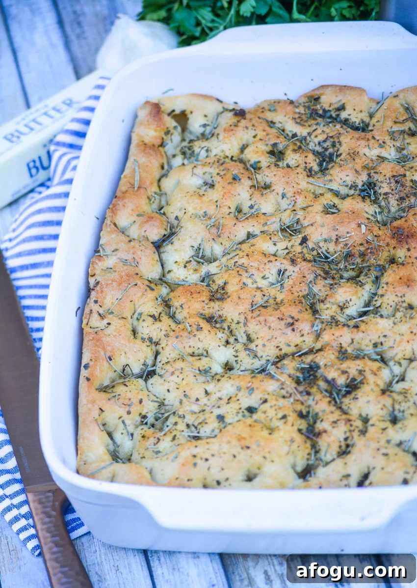 shortcut focaccia bread in a white 9x13" baking dish