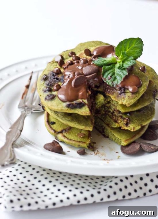 Mint Chocolate Chip Blender Pancakes - green pancakes with dark chocolate chips