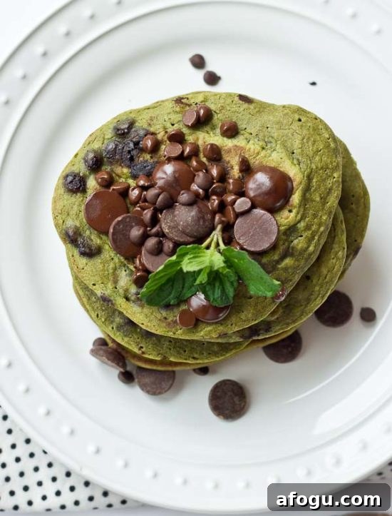 Stack of green pancakes with chocolate chips