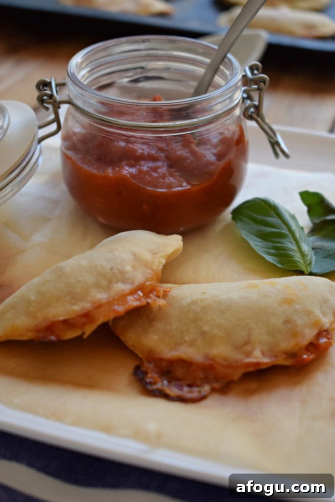 Pizza Pocket Bites with a jar of pizza sauce