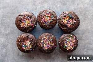 cupcakes with holes filled with sprinkles