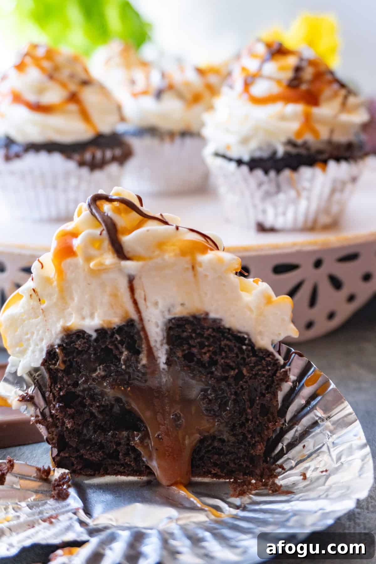 chocolate cupcake cut in half and caramel coming out