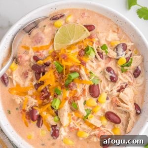 Slow Cooker White Chicken Chili is a mouthwatering dish that is a perfect blend of creamy flavors. The BEST crock pot chicken chili recipe!