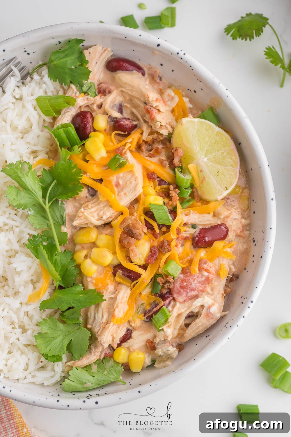 Slow Cooker White Chicken Chili is a mouthwatering dish that is a perfect blend of creamy flavors. The BEST crock pot chicken chili recipe!