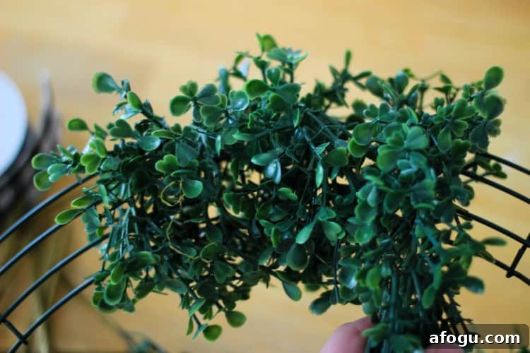 wrapping garland around wreath base