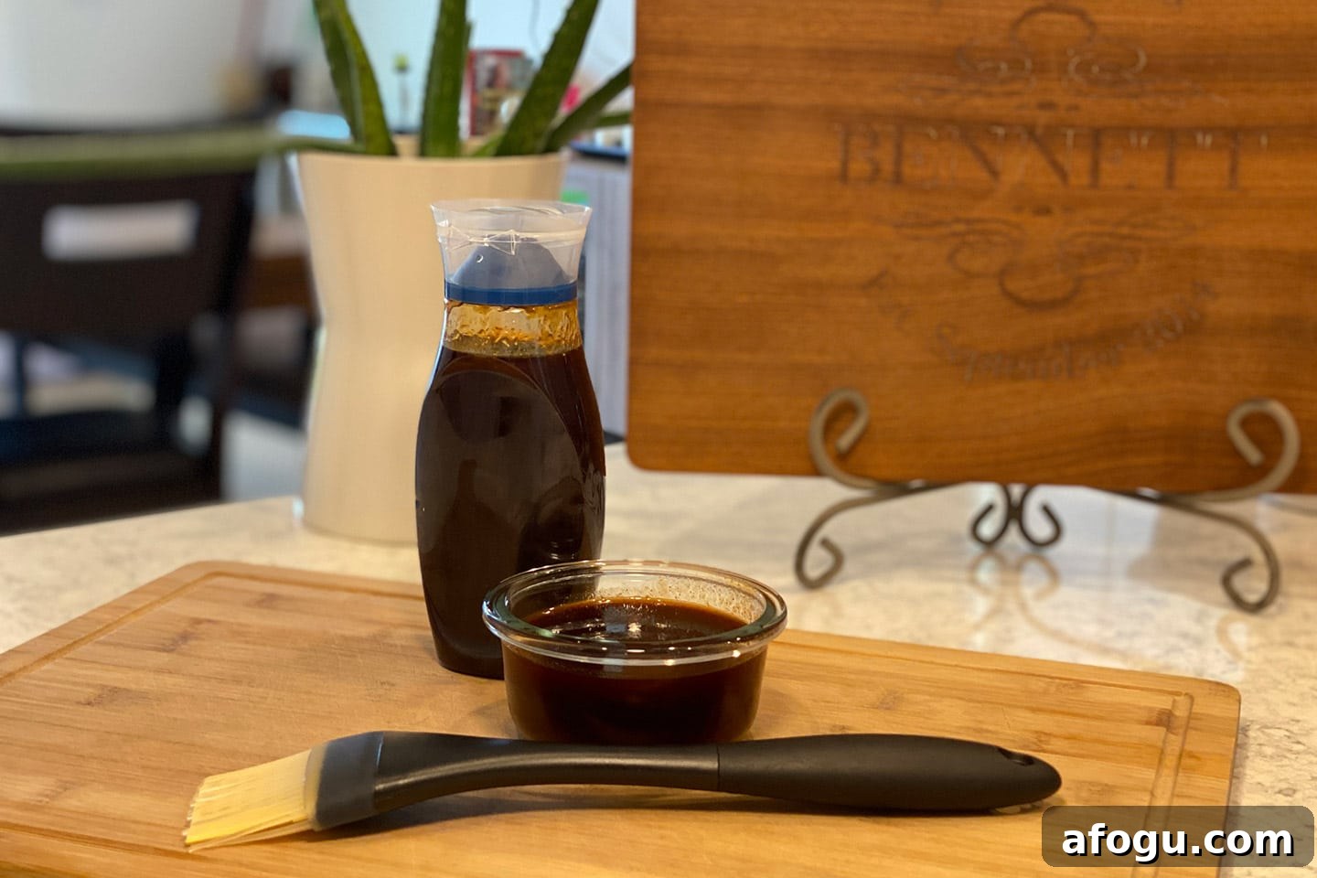 Homemade BBQ Sauce on a counter with a brush