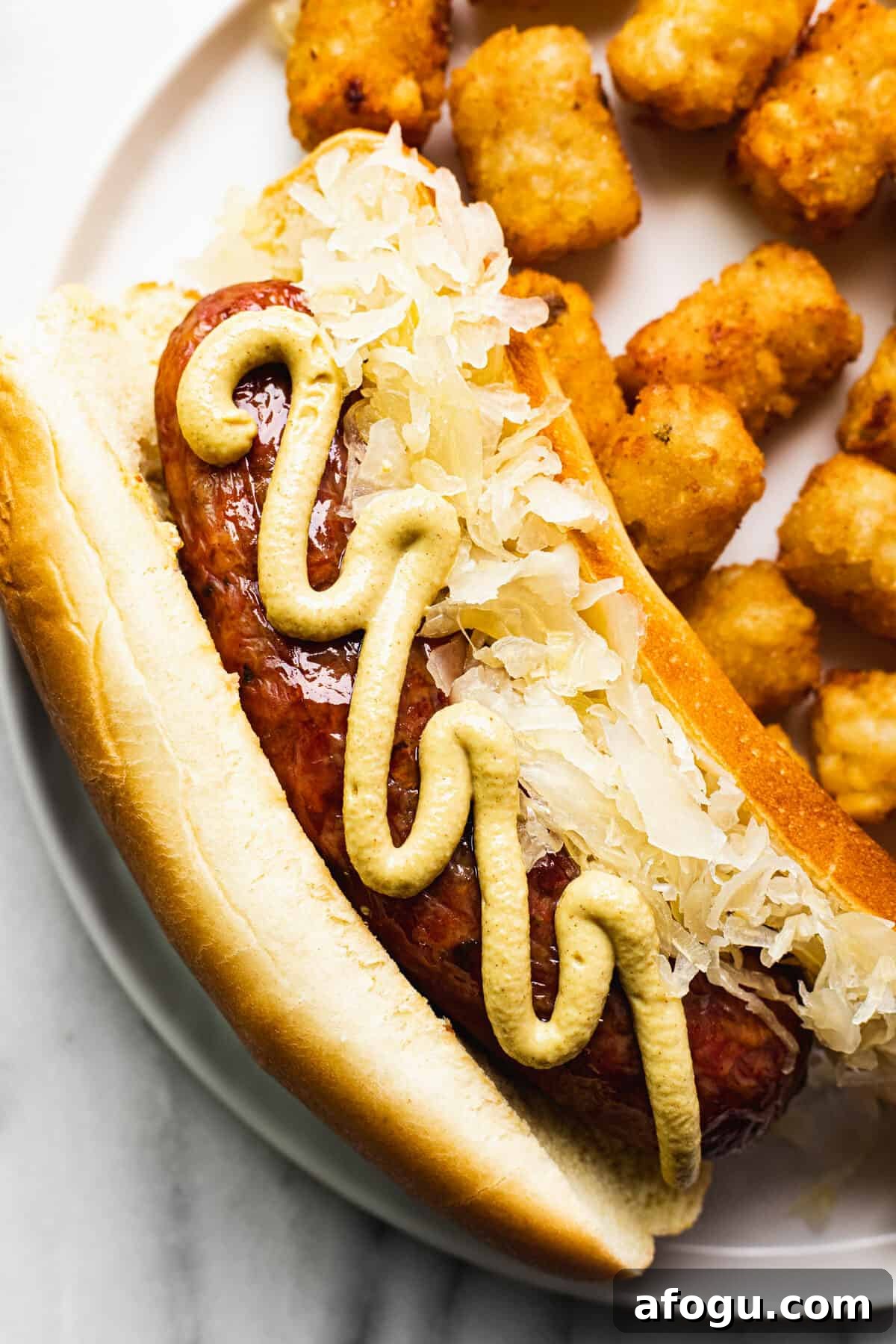 Smoked sausage in a bun with Dijon mustard and sour kraut.