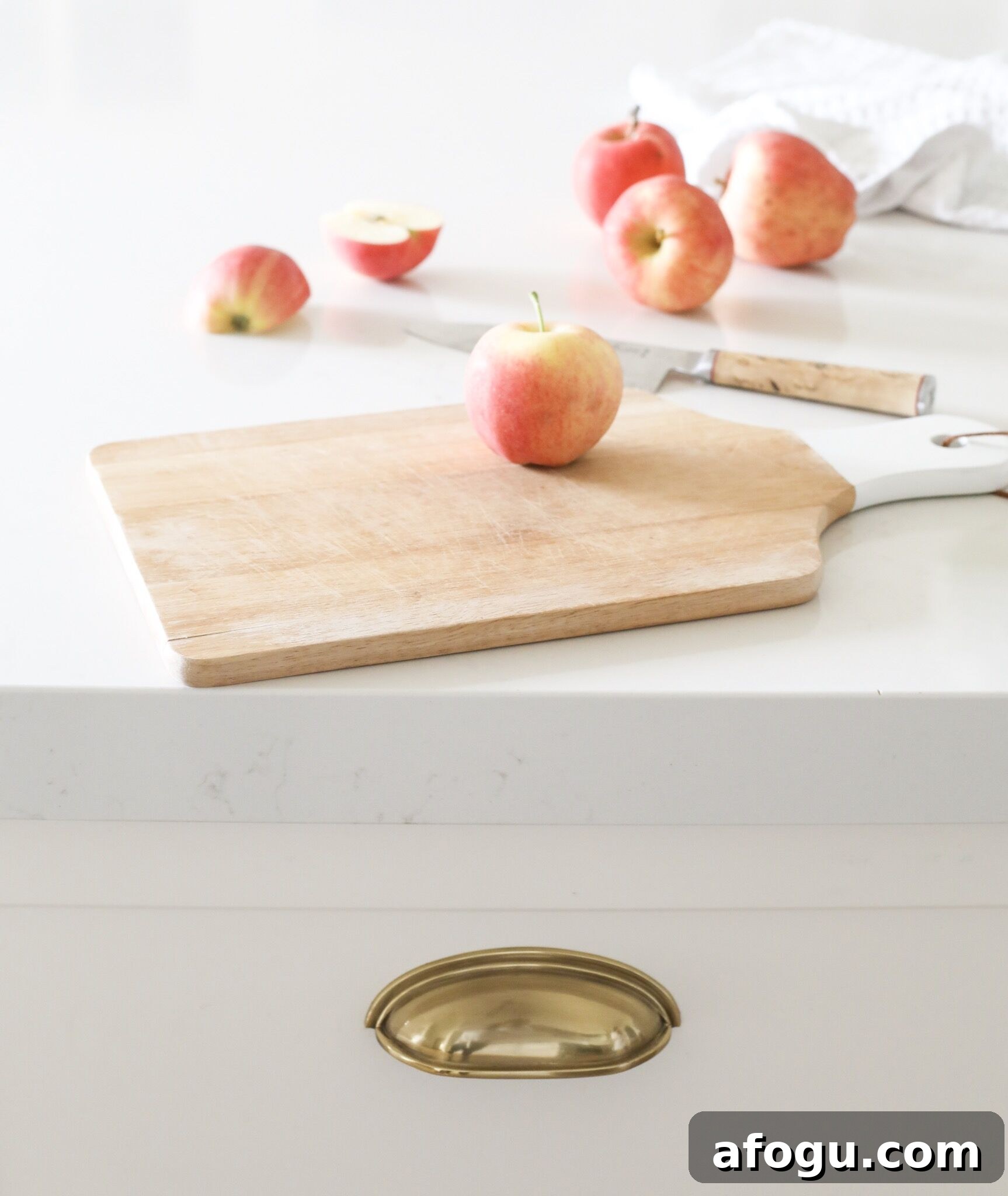 Fraiche Nutrition White Kitchen Reveal: brass antique French cup hardware and Silestone counter with Statuario