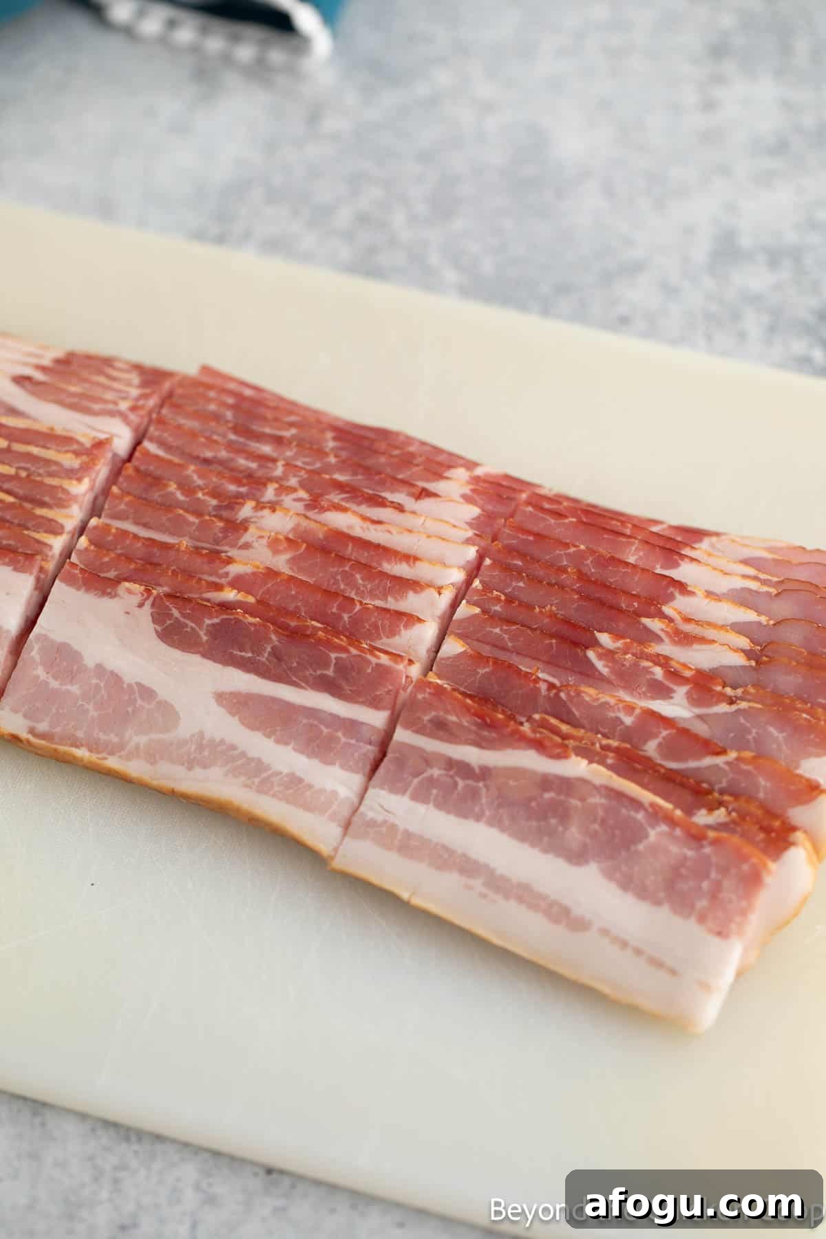 Bacon sliced into thirds.