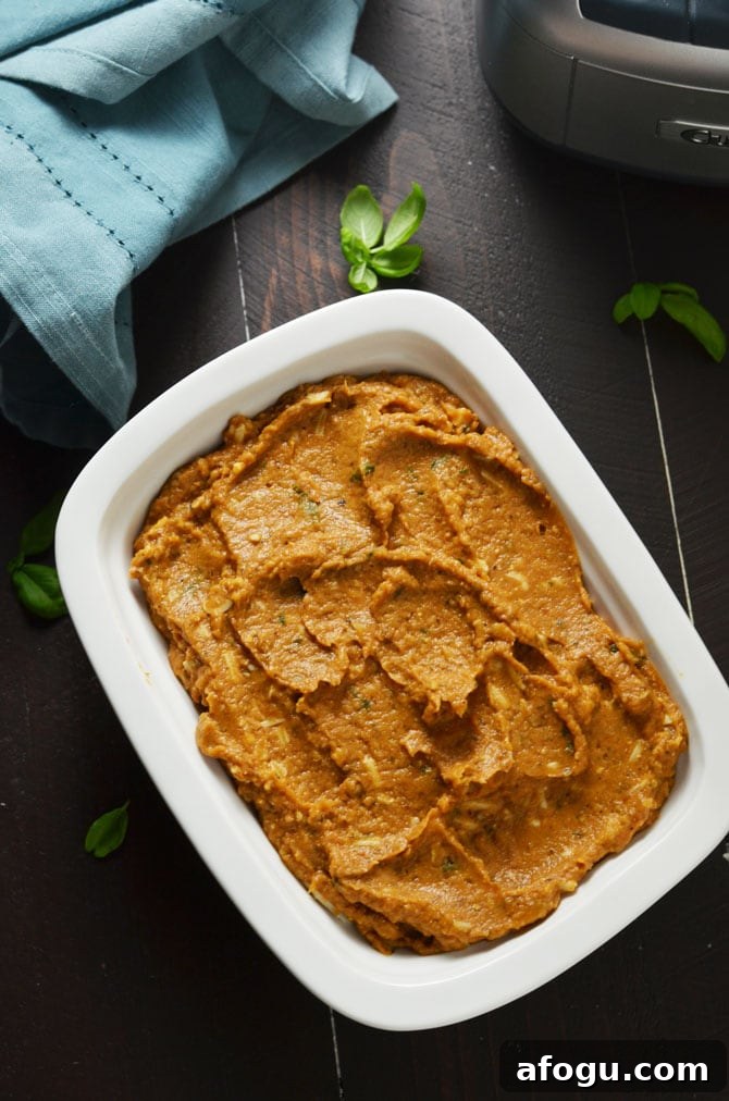 Eggplant Parmesan Dip. This warm, cheesy dip is loaded up with tomato sauce, garlic, and roasted eggplant. I love making it for winter parties. | hostthetoast.com