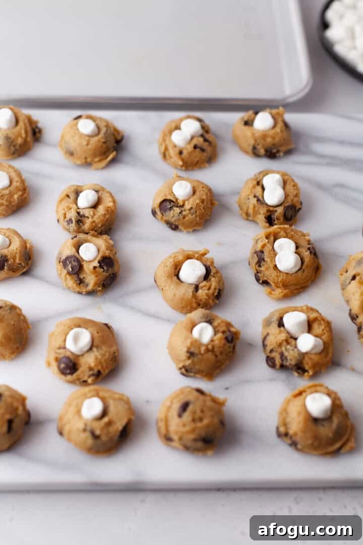 adding marshmallows to the cookies before baking